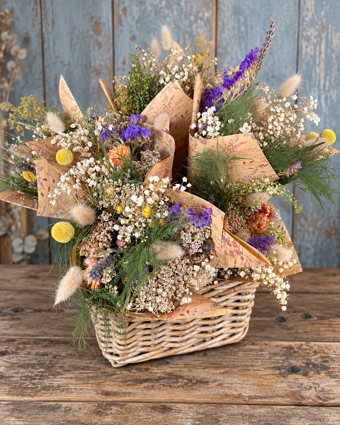 Basket of handmade Scottish mini dried flower bouquets wrapped in floral paper by Home Farm Flowers & Crafts